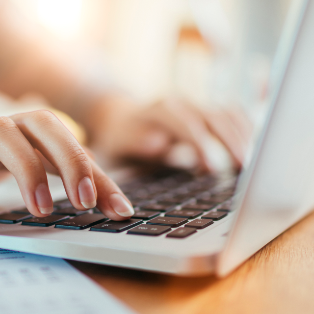 Closeup of a woman's hands on laptop