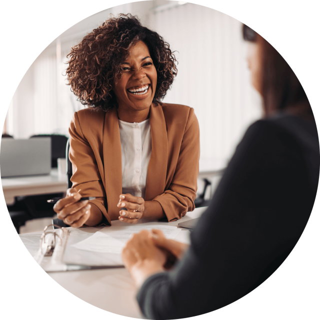 Woman smiling at desk