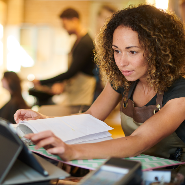 Woman reading financial reports