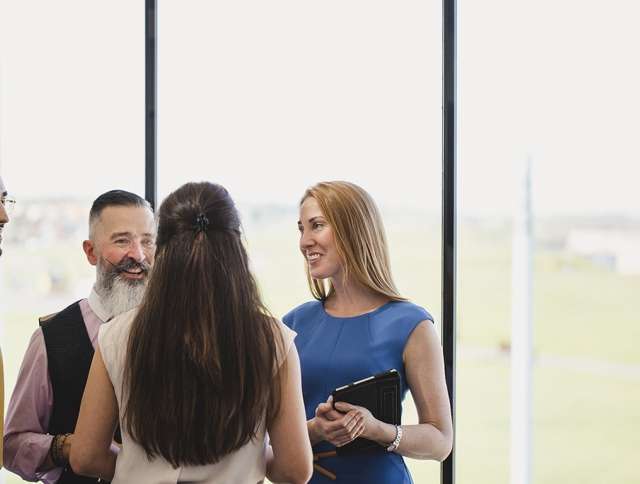 Coworkers standing and talking