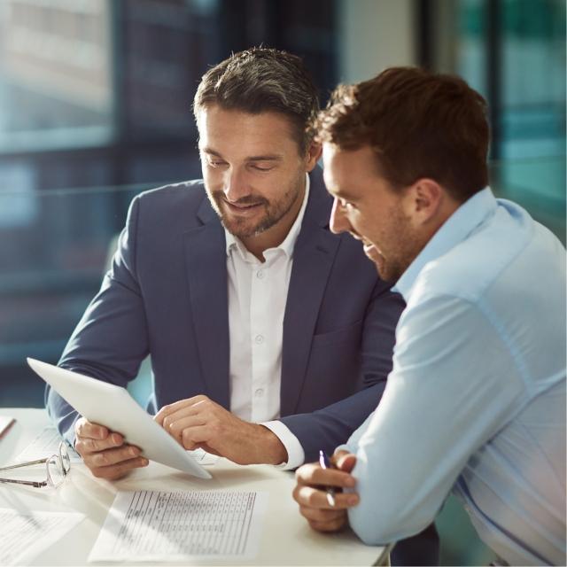 Men discussing benefits of Conga Sign