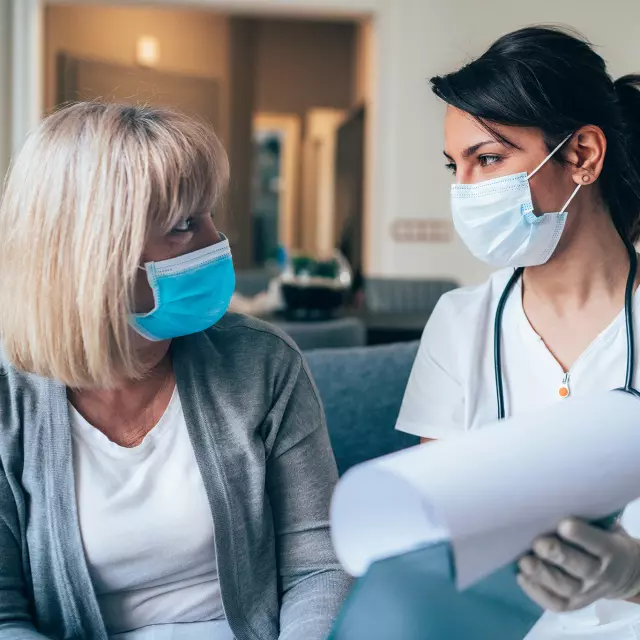 Doctor explaining medical charts to patient