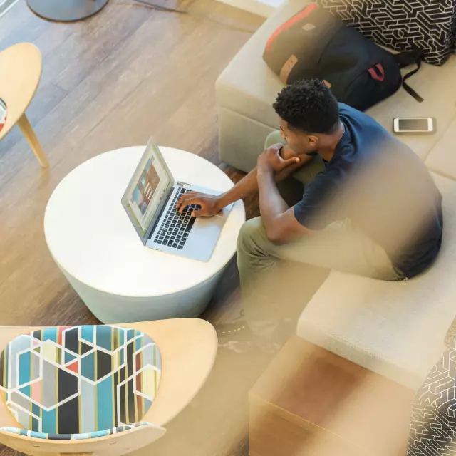 Overhead shot of man working on laptop