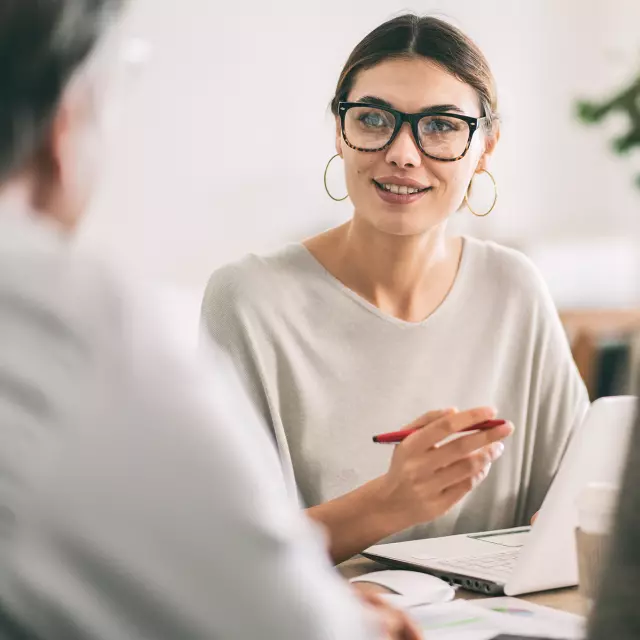 Woman talking to a man