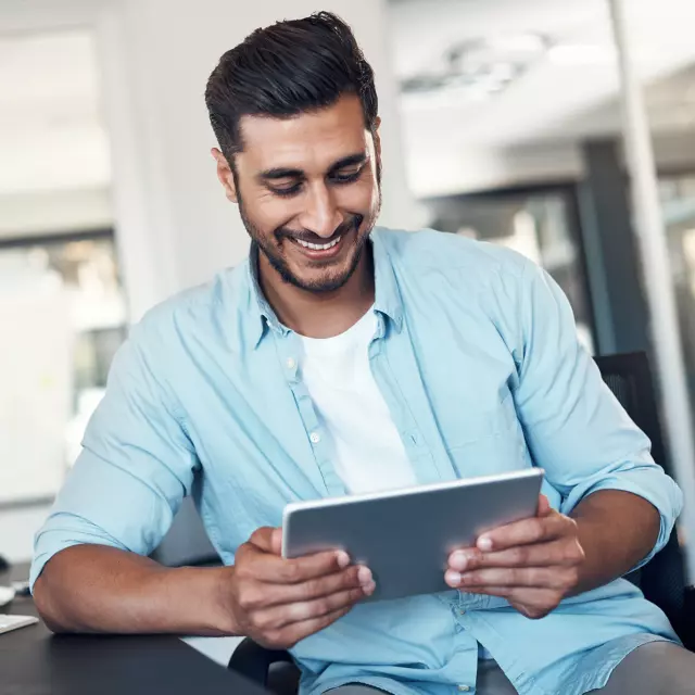 Man looking at tablet