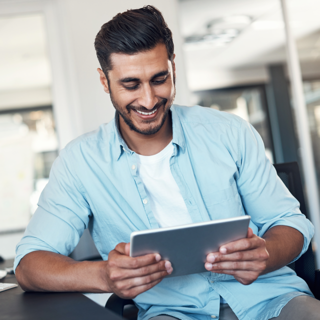 Man looking at tablet