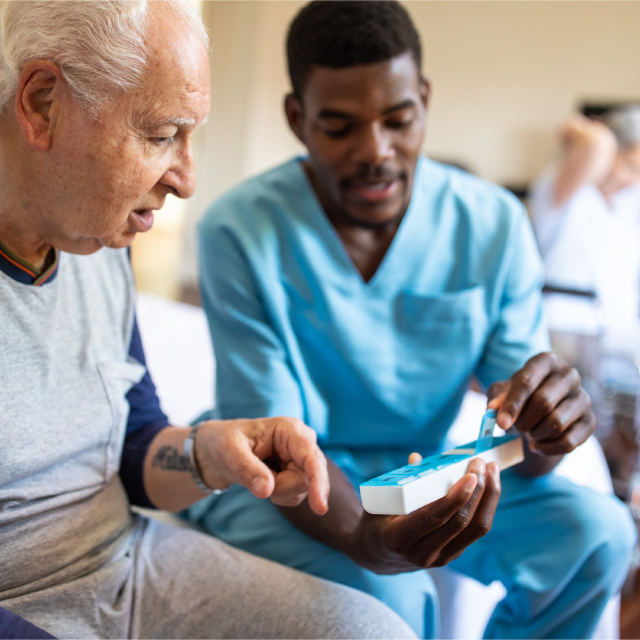 Nurse providing medication to patient