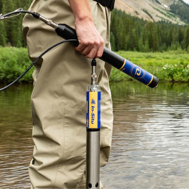 Man standing by a pond