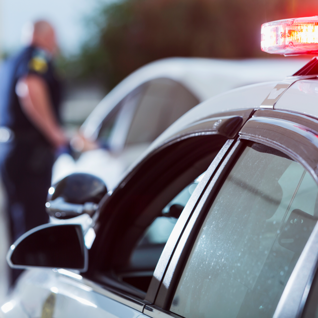 Police car pulling over a car