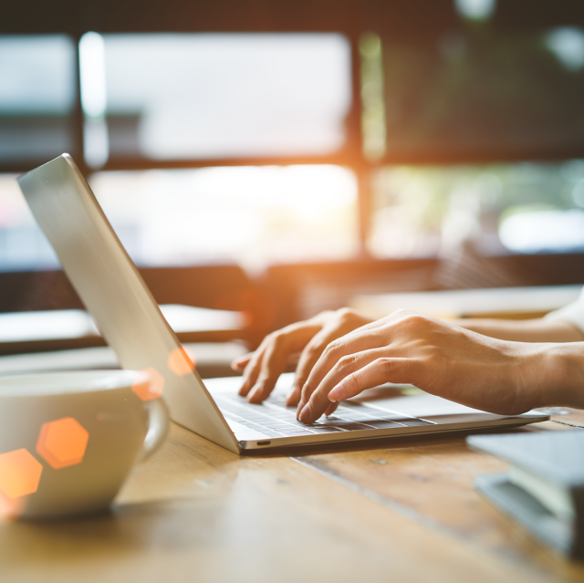 Person typing on laptop