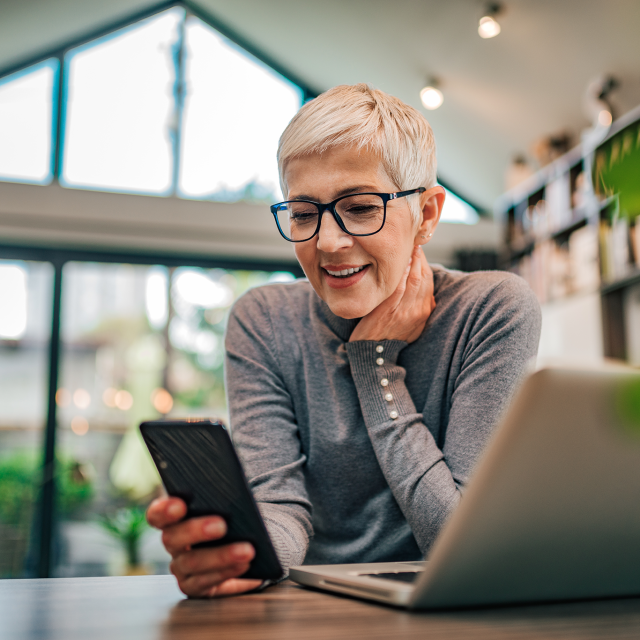 Woman smiling on cell phone