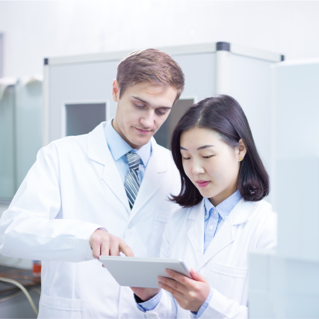 Lab technicians using Conga products on tablet