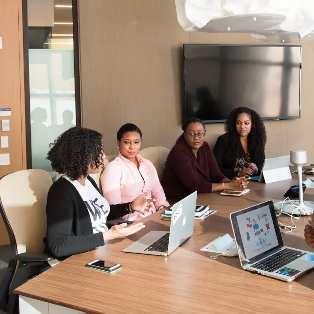 Coworkers sitting at conference table