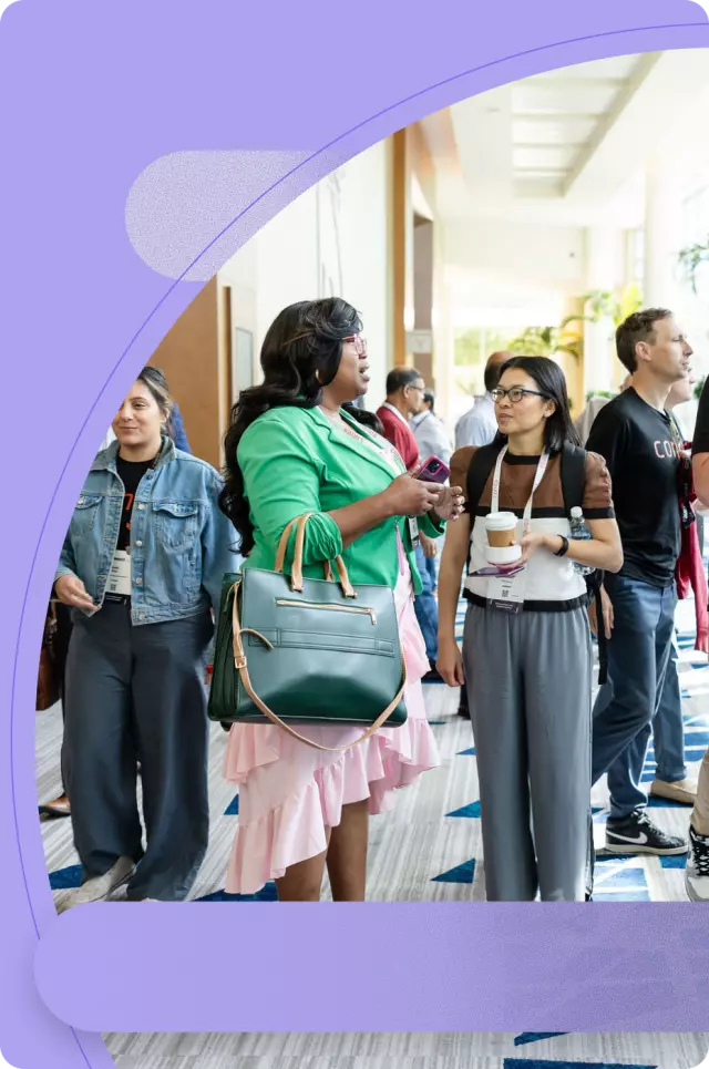 Conga customers smiling at a conference