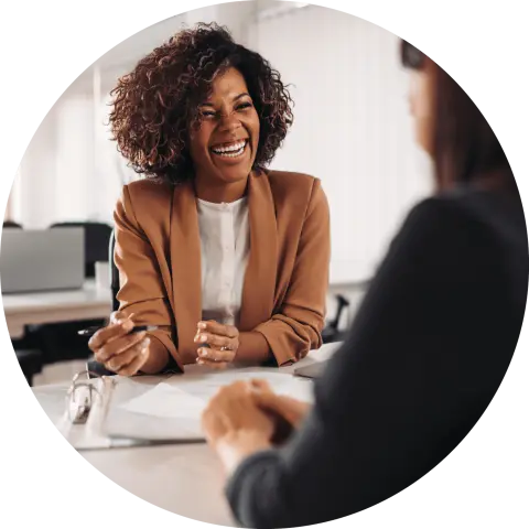 Woman smiling at desk